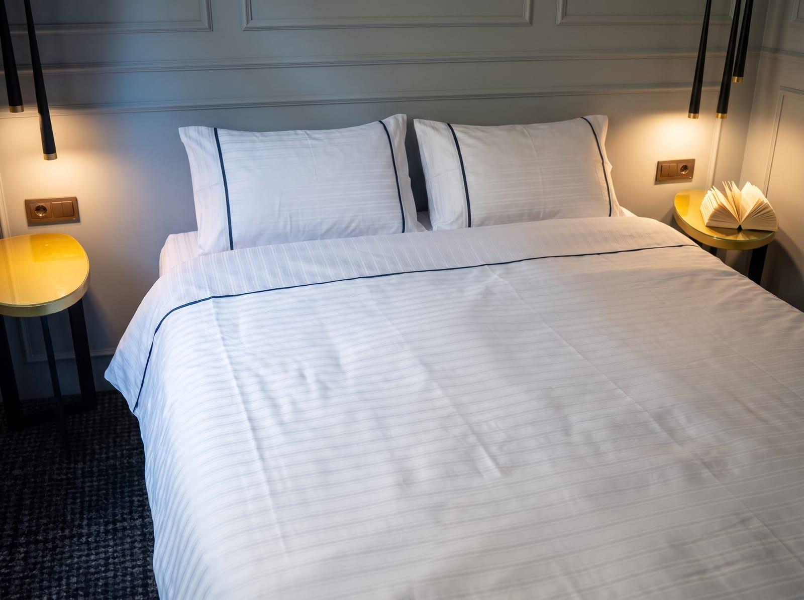 Light grey-blue mix with navy piping bedding set